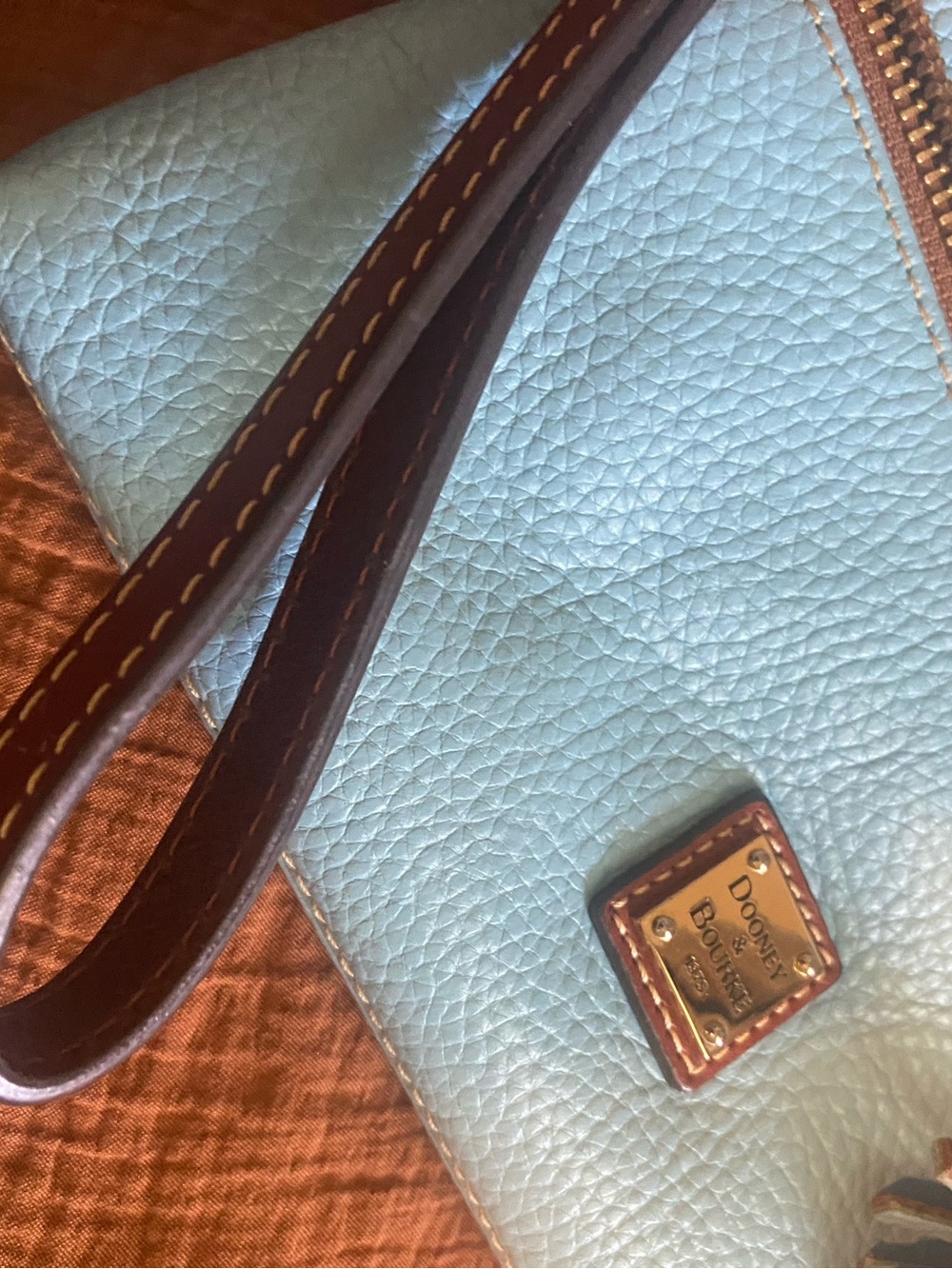 Dooney & Bourke Light Blue Pebbled Leather Clutch with Brown Trim